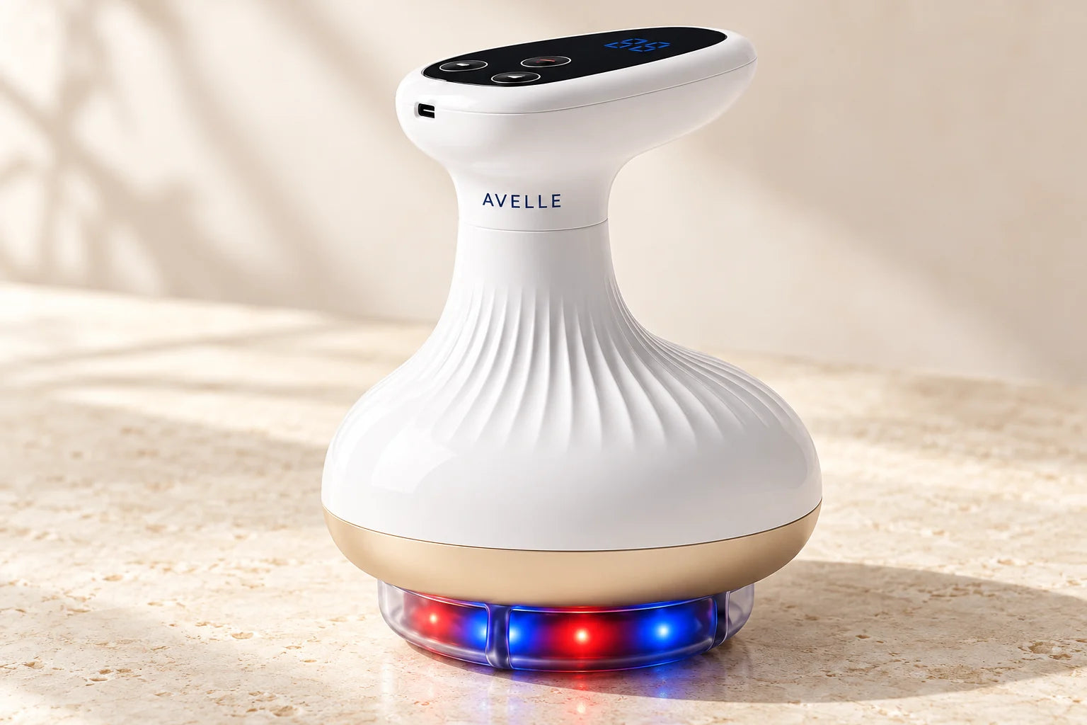The AVELLE massager: white fluted body, black controls, gold rim and red and blue lights